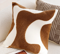 Housse de coussin motif vagues marron