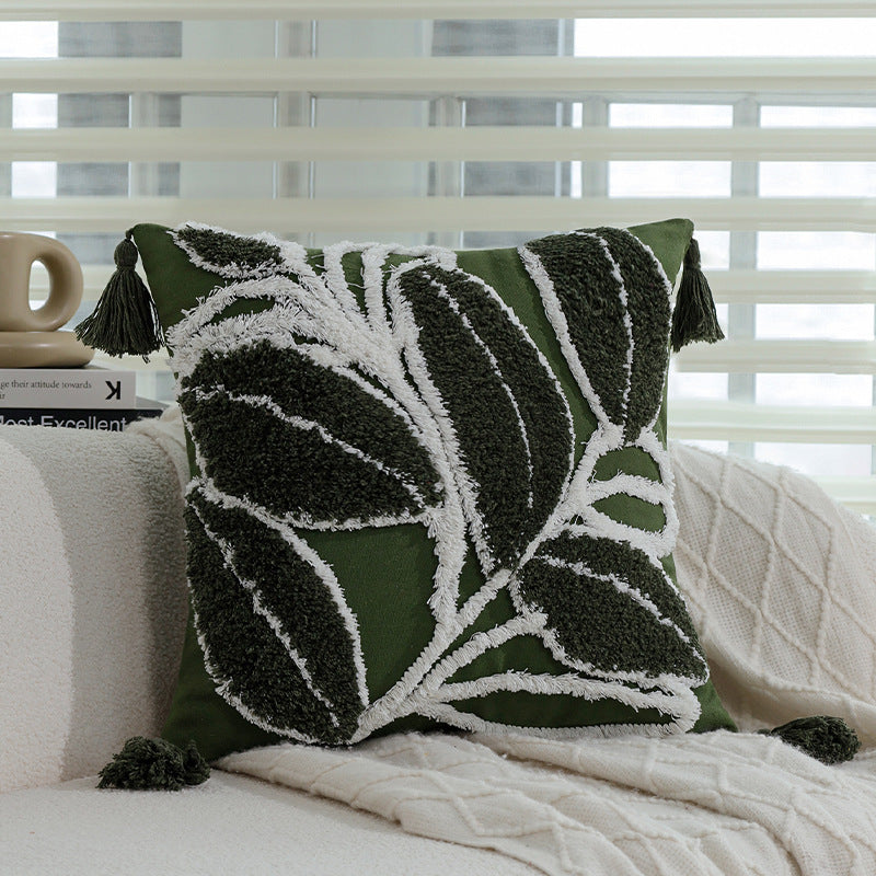 Coussin vert brodé motif feuillage